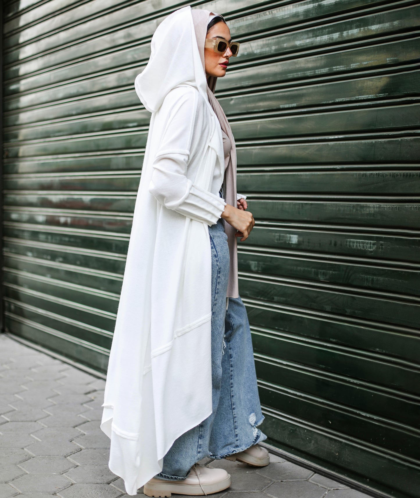 Asymmetrical Stitches Wool Cardigan in White.