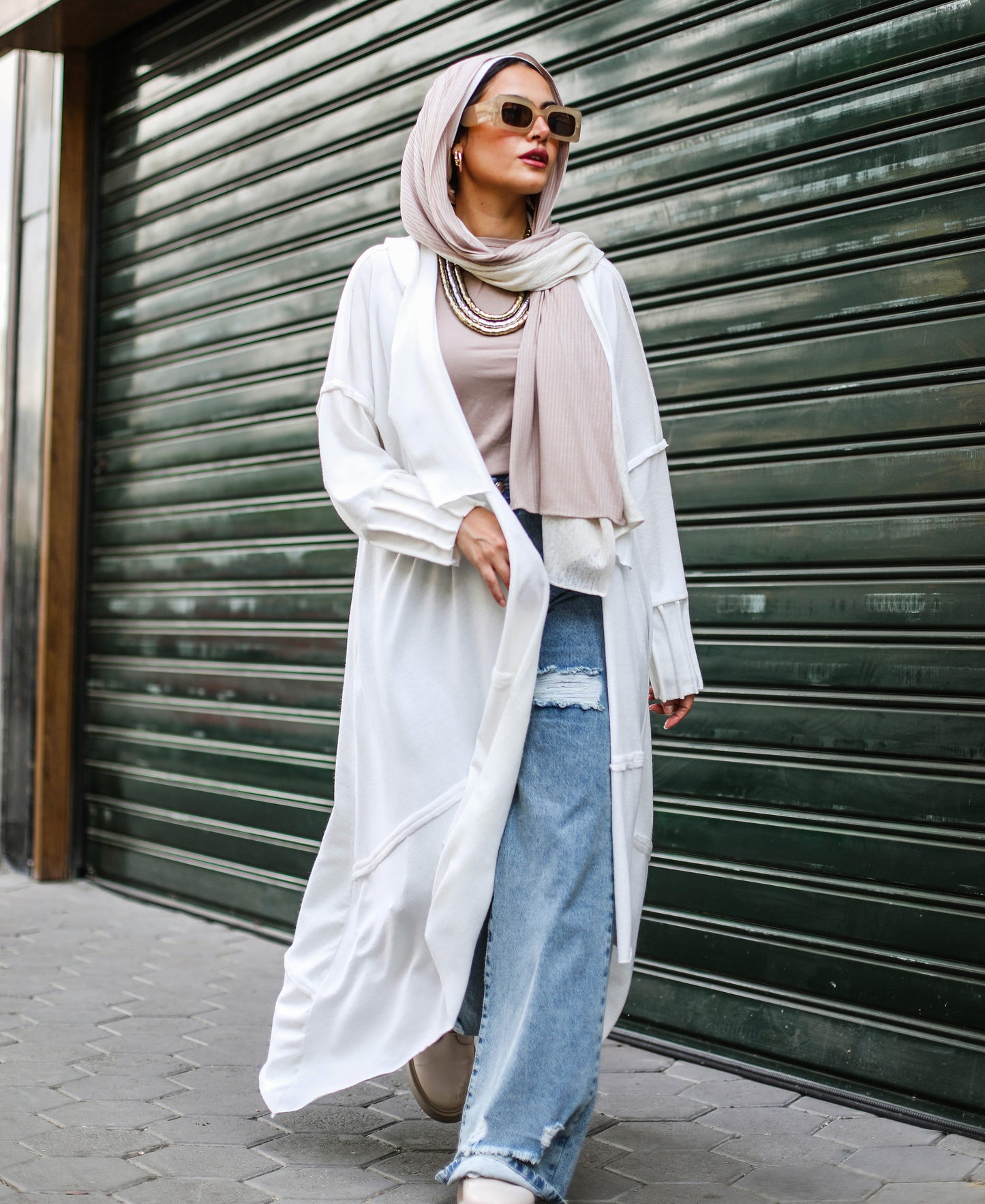 Asymmetrical Stitches Wool Cardigan in White.
