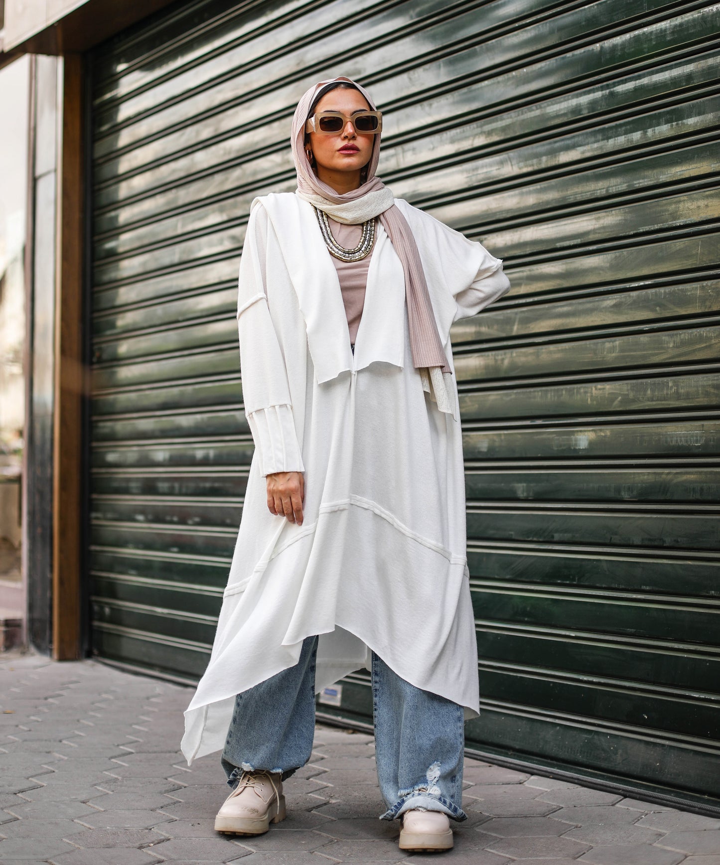 Asymmetrical Stitches Wool Cardigan in White.