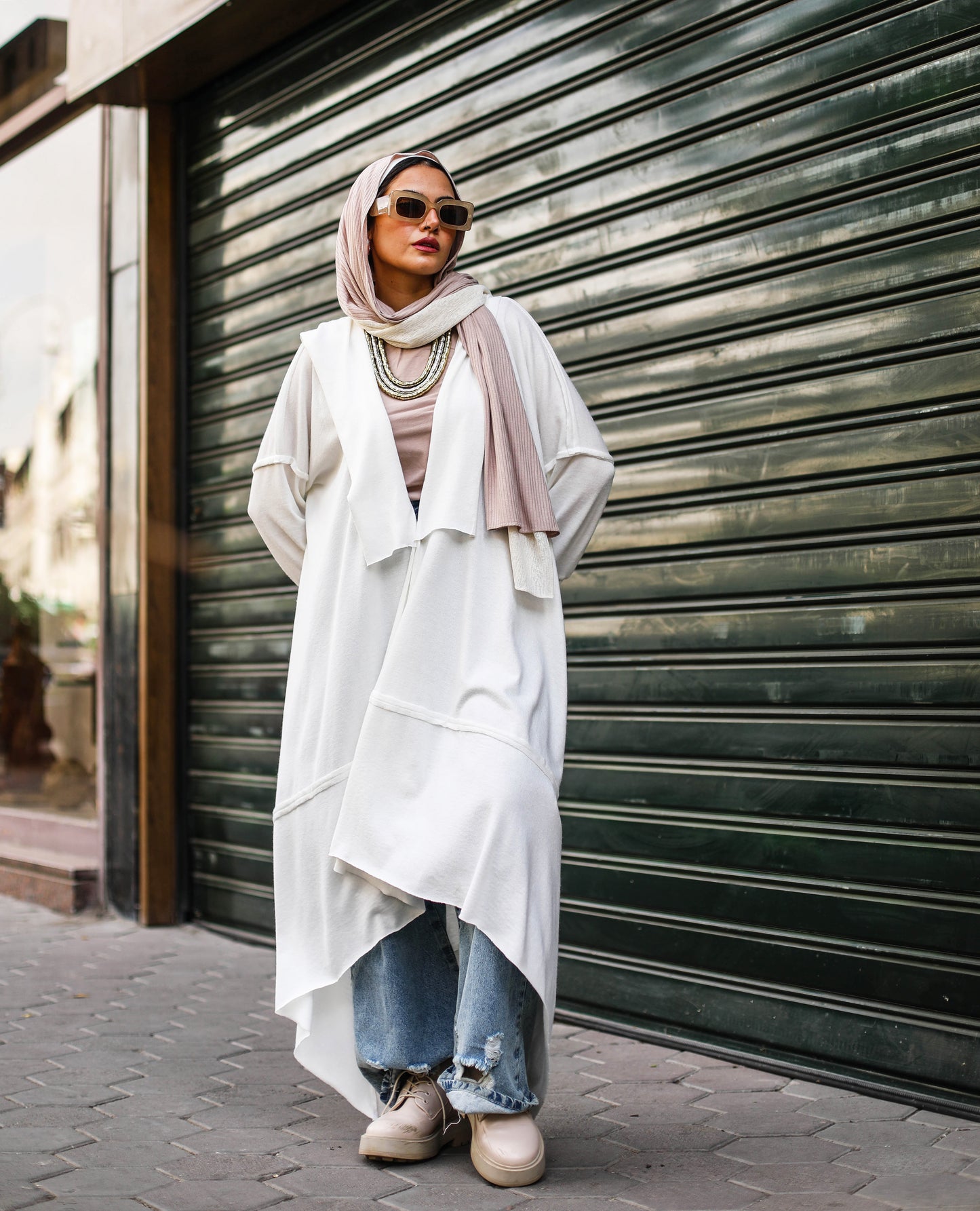 Asymmetrical Stitches Wool Cardigan in White.
