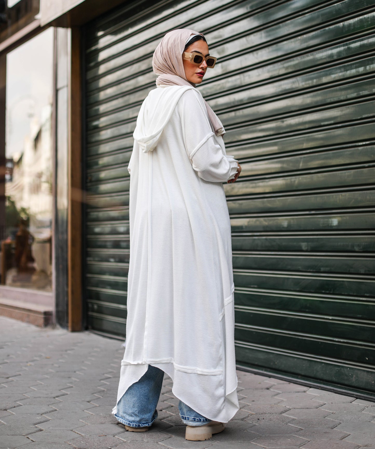 Asymmetrical Stitches Wool Cardigan in White.