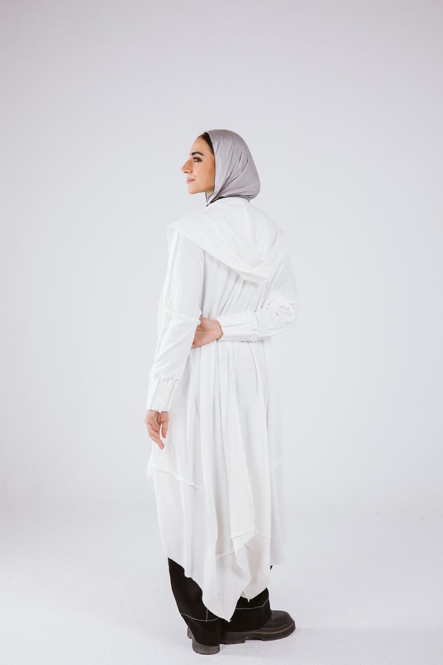 Asymmetrical Stitches Wool Cardigan in White.