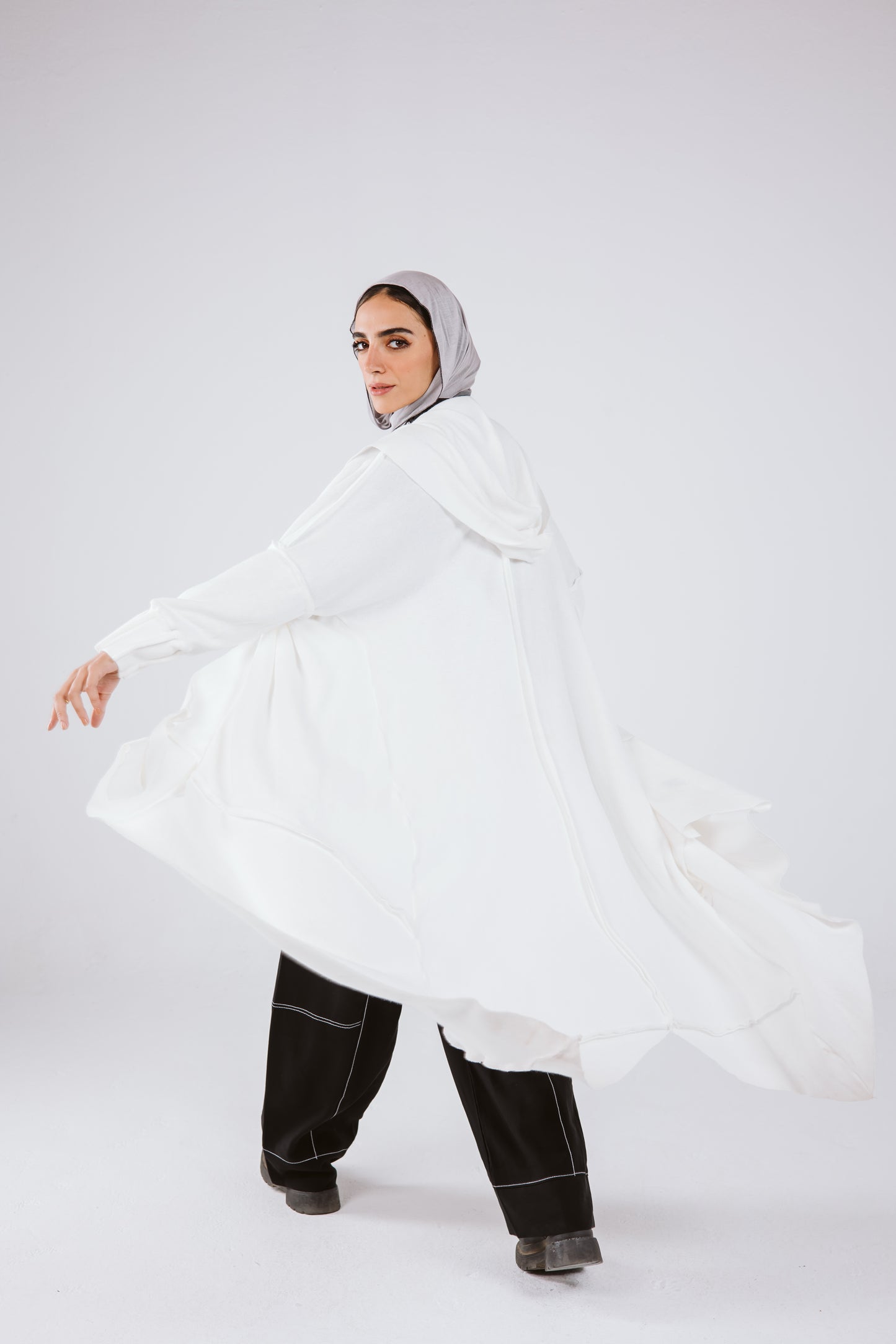 Asymmetrical Stitches Wool Cardigan in White.