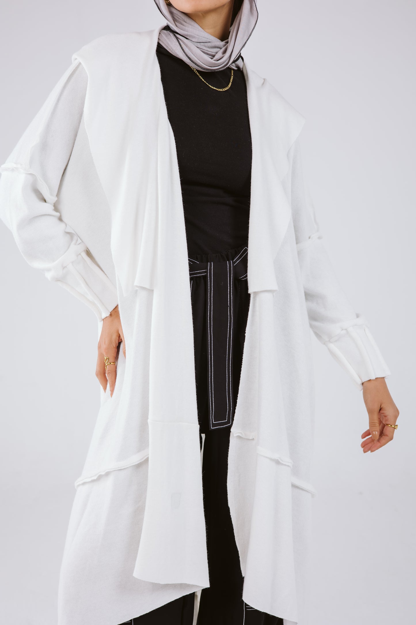 Asymmetrical Stitches Wool Cardigan in White.