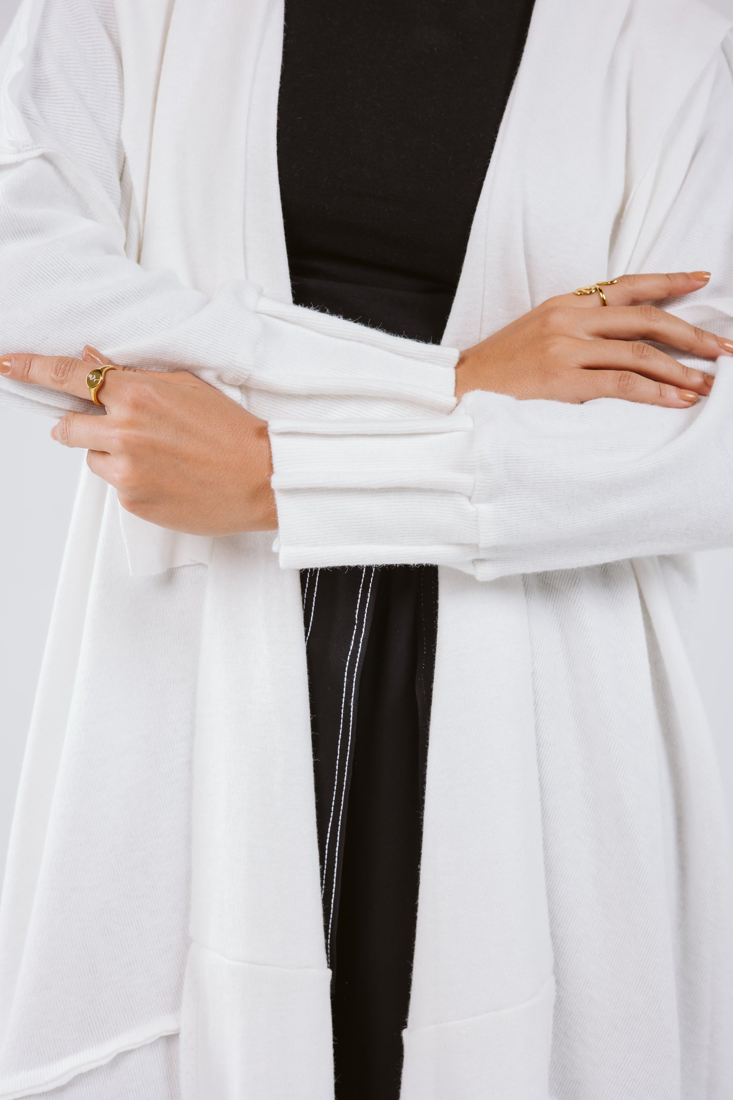 Asymmetrical Stitches Wool Cardigan in White.
