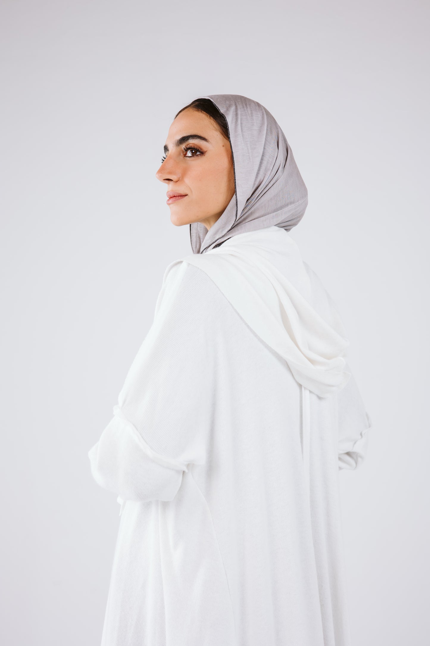 Asymmetrical Stitches Wool Cardigan in White.