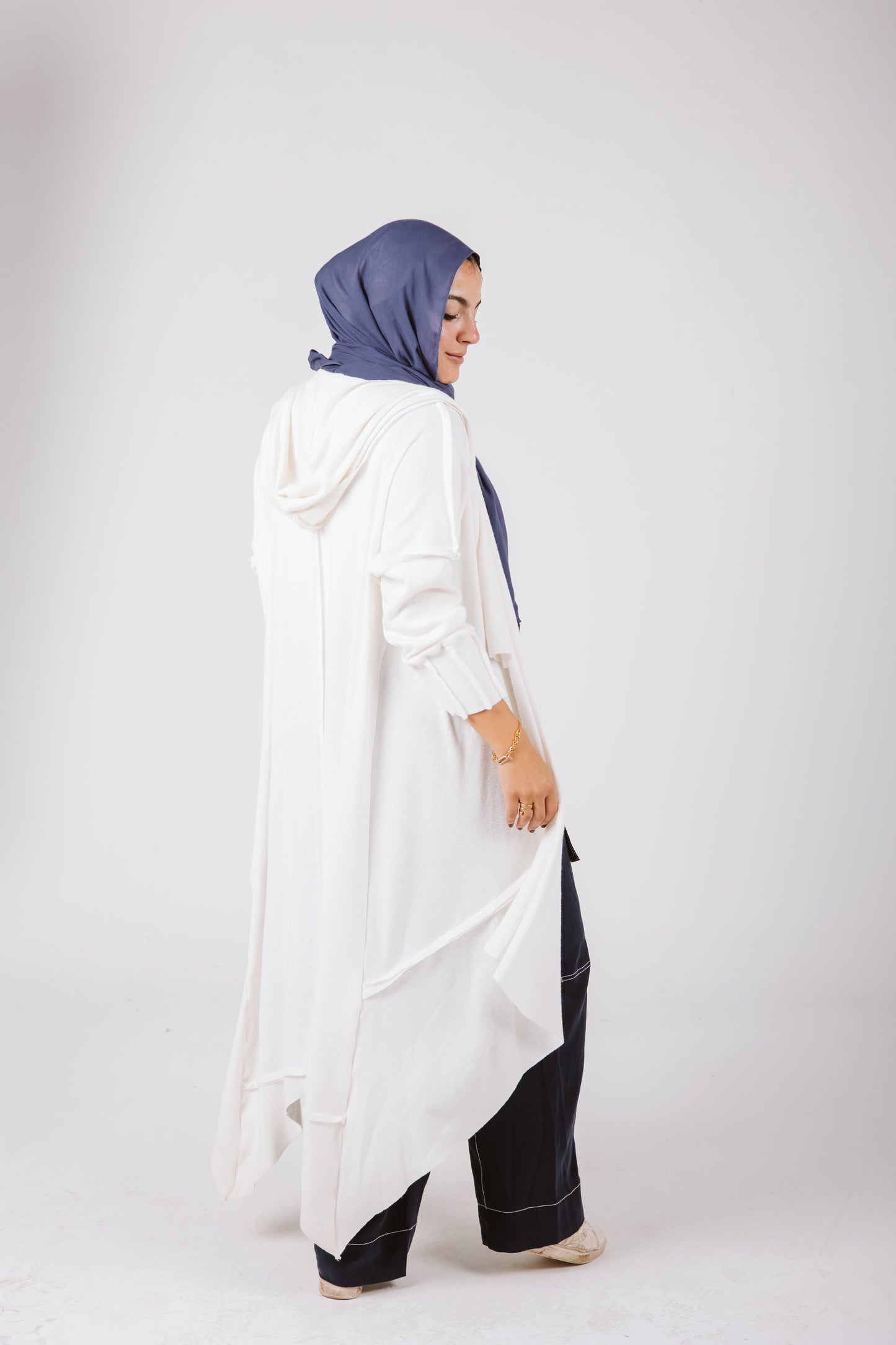 Asymmetrical Stitches Wool Cardigan in White.