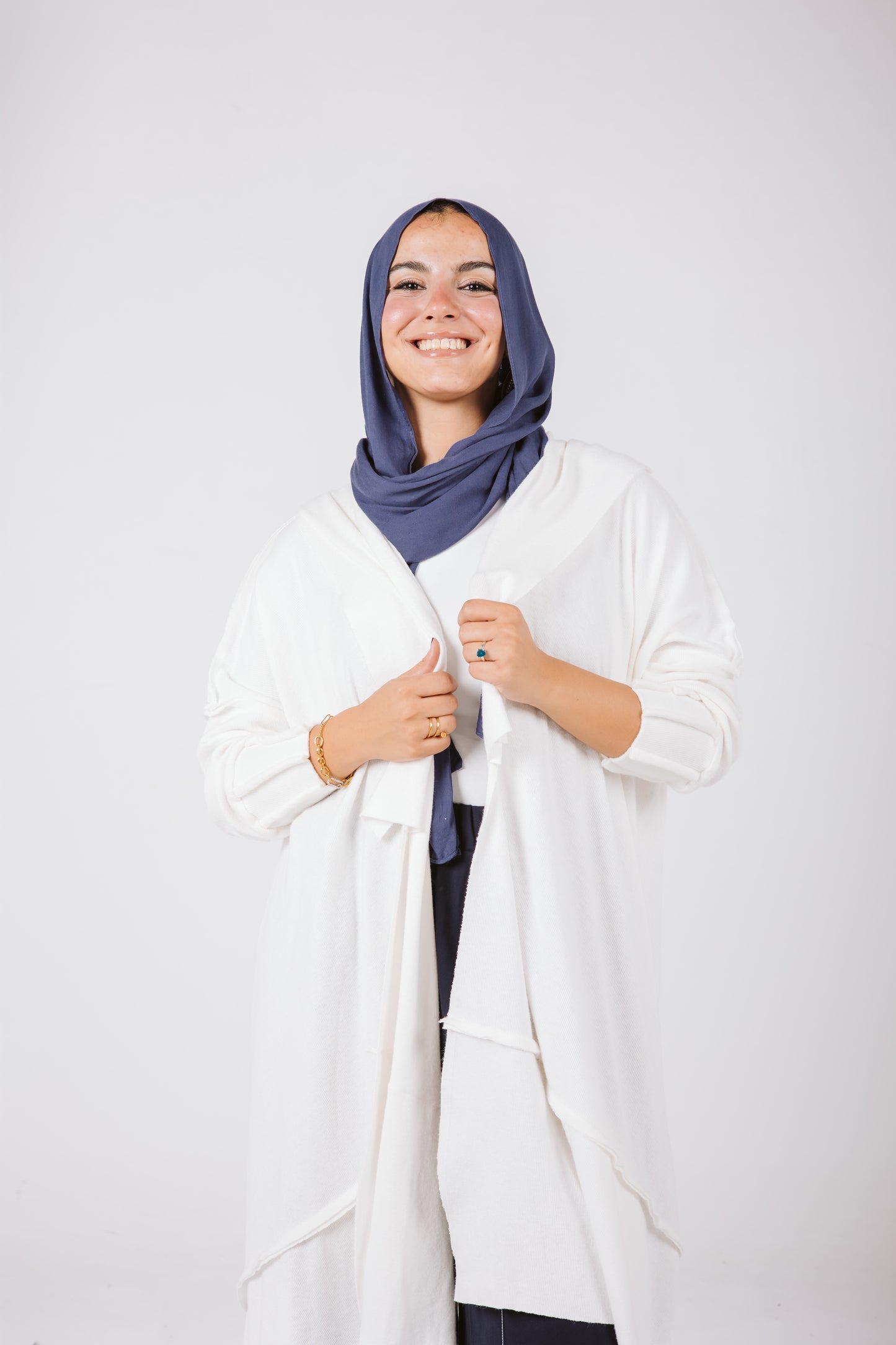 Asymmetrical Stitches Wool Cardigan in White.