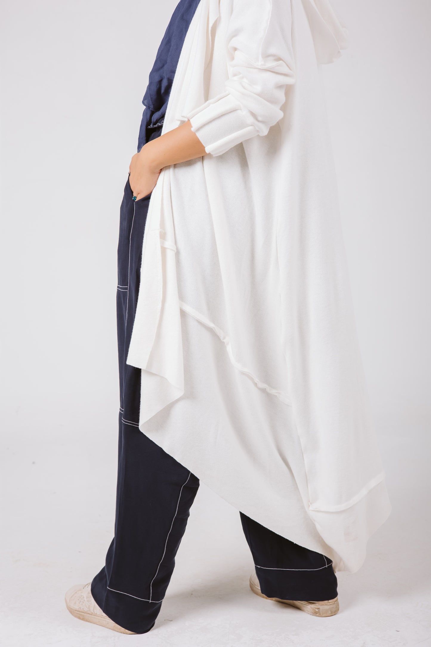 Asymmetrical Stitches Wool Cardigan in White.