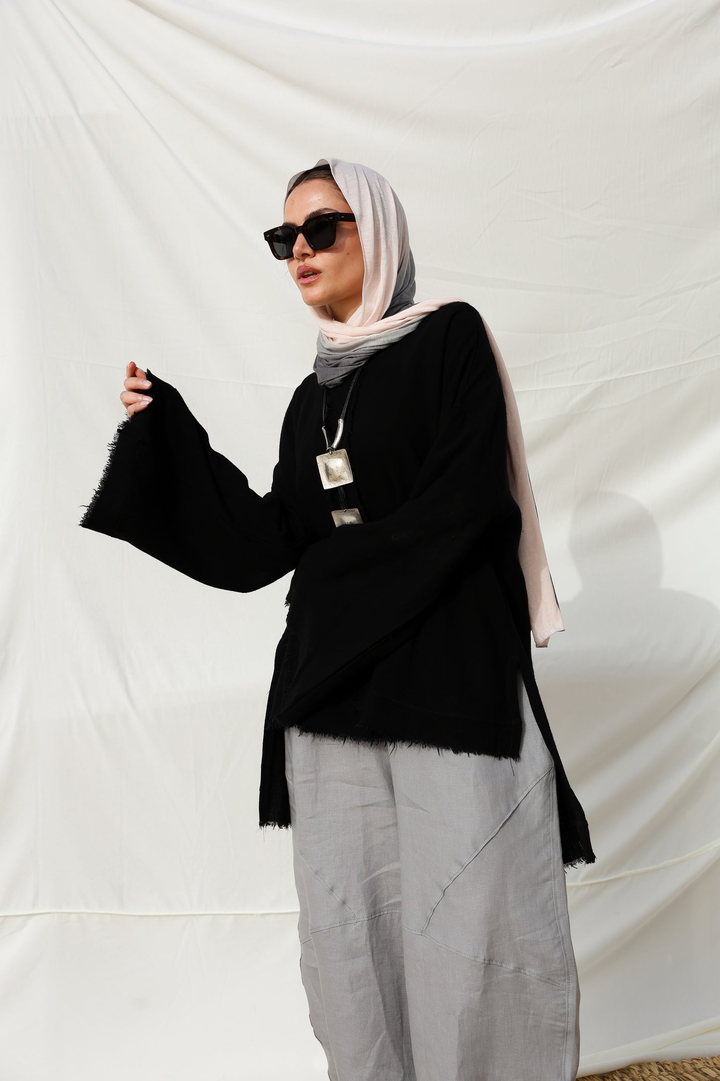 The Unfinished Bell Sleeves Linen Top in Black