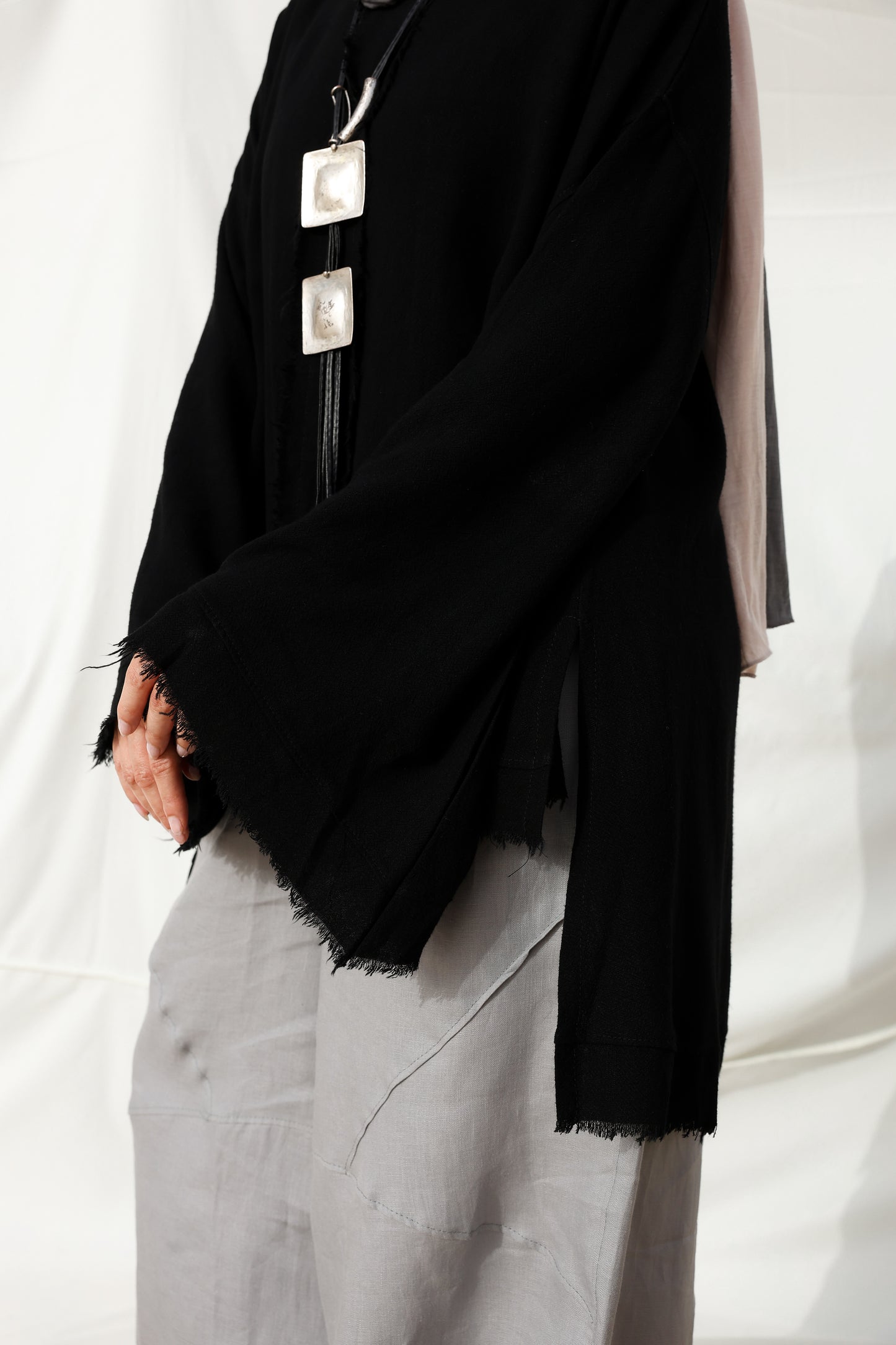 The Unfinished Bell Sleeves Linen Top in Black